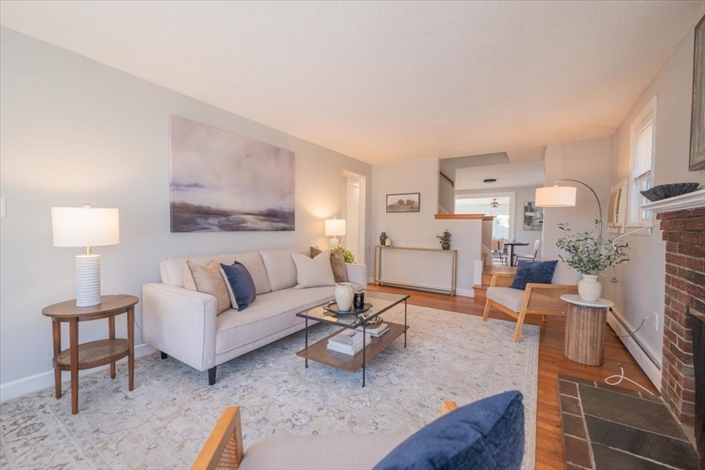 33 Kensington Road Dedham, MA 02026 - Photo 14 of 31 a living room with furniture and a lamp