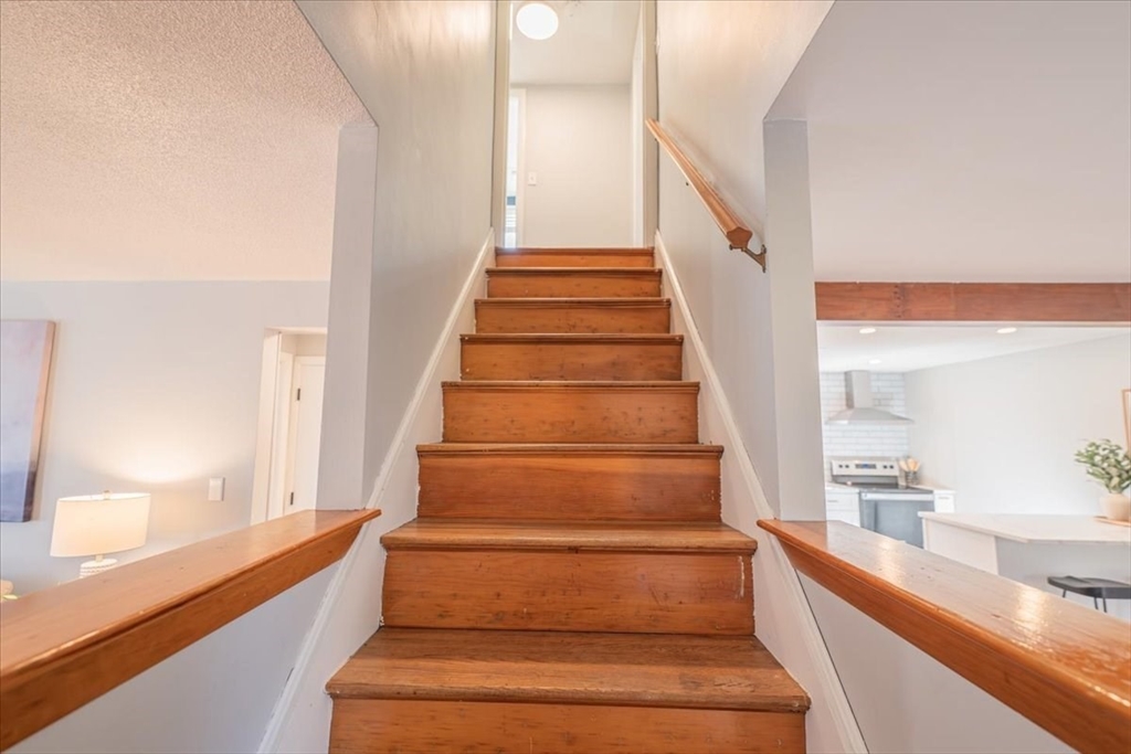 33 Kensington Road Dedham, MA 02026 - Photo 20 of 31 a view of entryway and hall with wooden floor