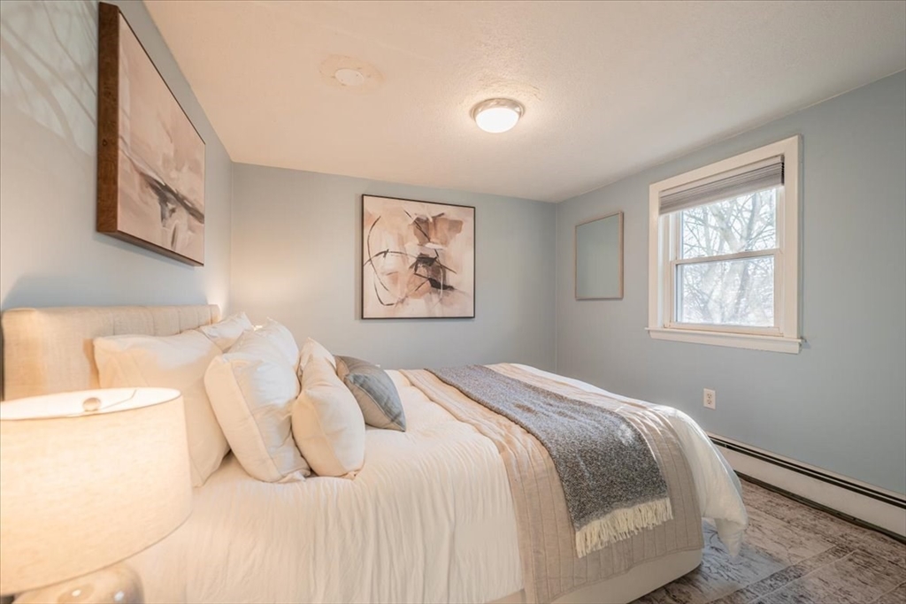 33 Kensington Road Dedham, MA 02026 - Photo 23 of 31 a bedroom with a bed and a window
