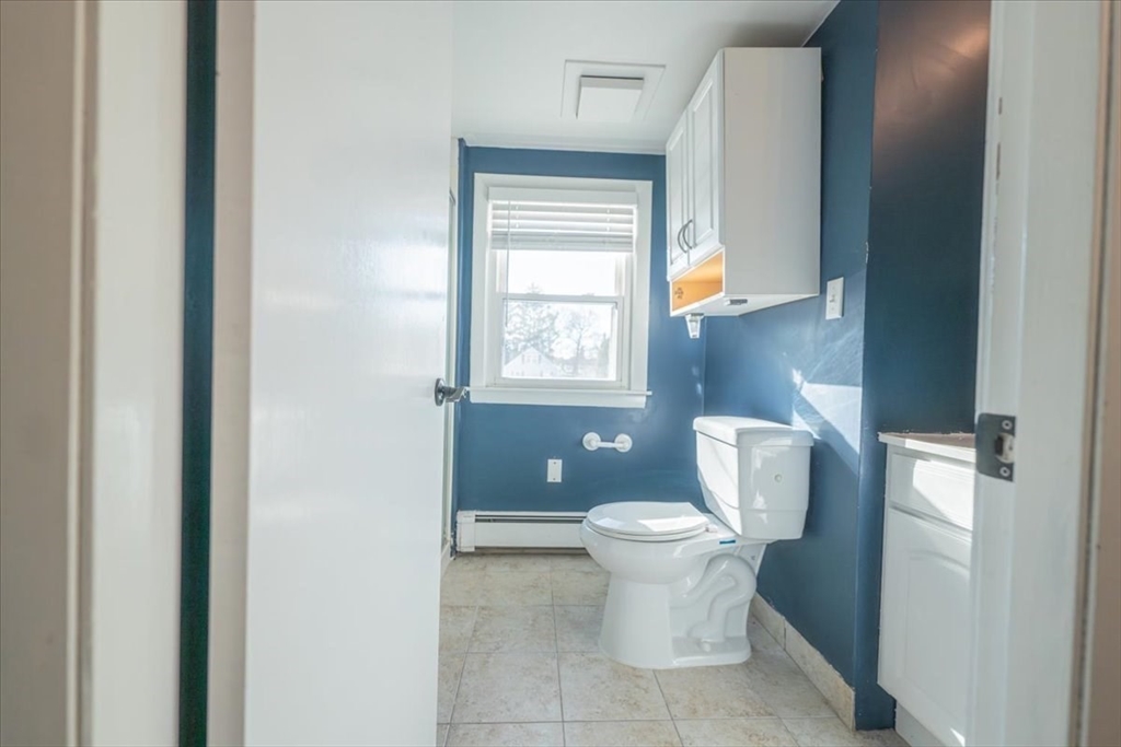 33 Kensington Road Dedham, MA 02026 - Photo 25 of 31 a white toilet sitting next to a bathroom sink