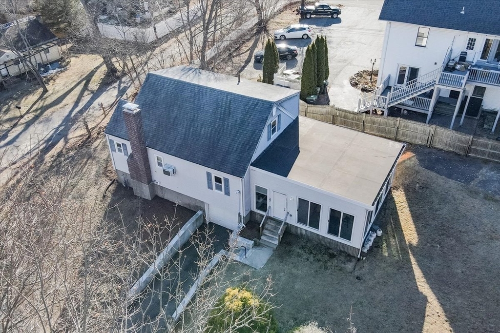 33 Kensington Road Dedham, MA 02026 - Photo 26 of 31 a view of a house with a park