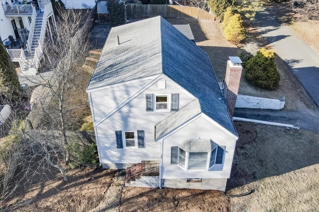 33 Kensington Road Dedham, MA 02026 - Photo 29 of 31 a view of a white house with a yard