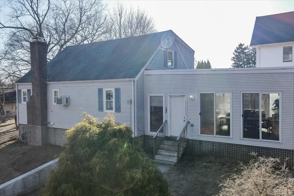 33 Kensington Road Dedham, MA 02026 - Photo 30 of 31 a front view of a house with garden