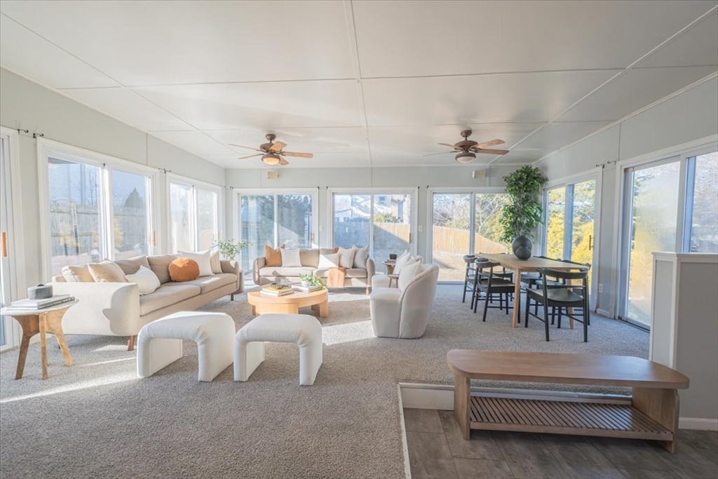 33 Kensington Road Dedham, MA 02026 - Photo 3 of 31 a living room with furniture and a large window
