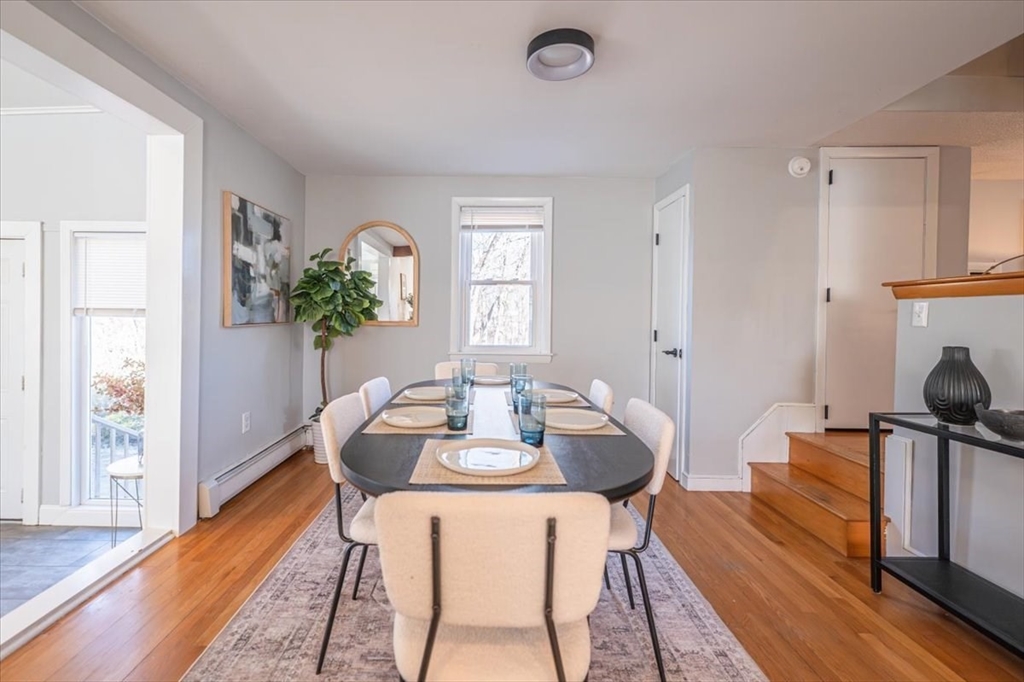 33 Kensington Road Dedham, MA 02026 - Photo 8 of 31 a living room with furniture and a potted plant