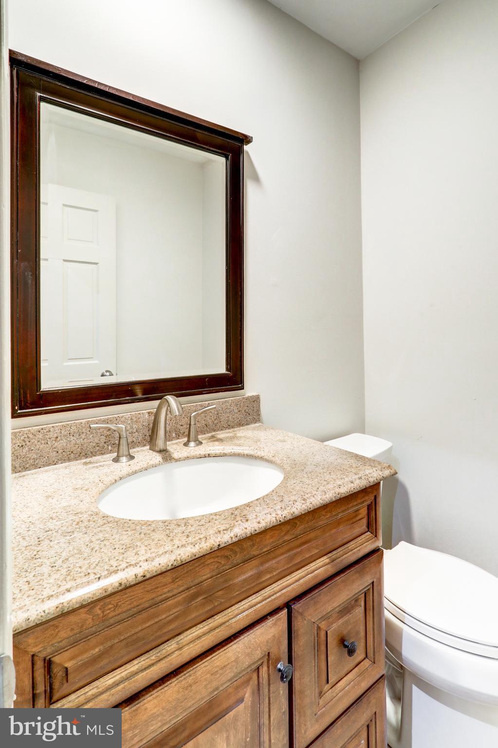 152 Kings Gate Drive Lititz, PA 17543 - Photo 20 of 45 a bathroom with a granite countertop sink and a mirror