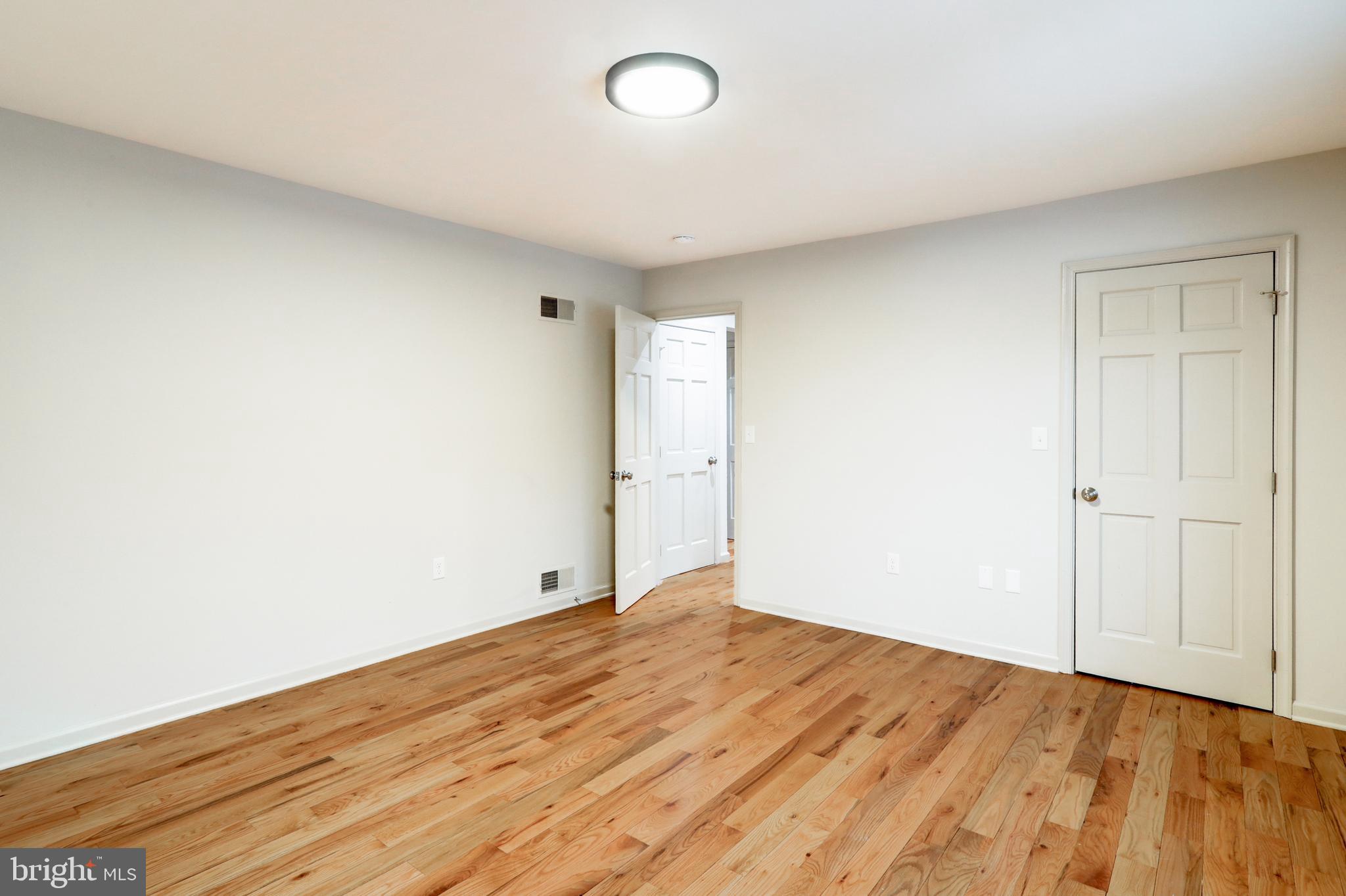 152 Kings Gate Drive Lititz, PA 17543 - Photo 22 of 45 an empty room with wooden floor and windows