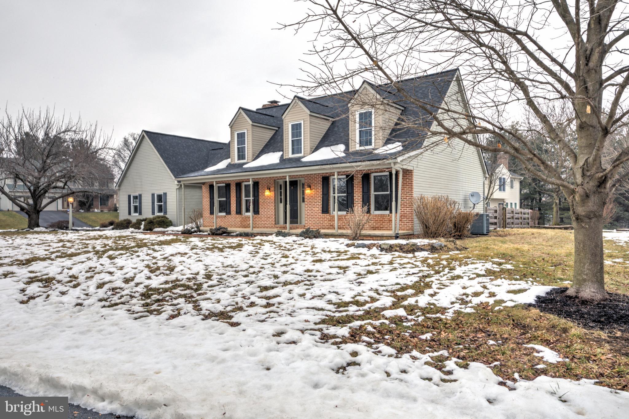 152 Kings Gate Drive Lititz, PA 17543 - Photo 36 of 45 a front view of a house with a yard covered in snow