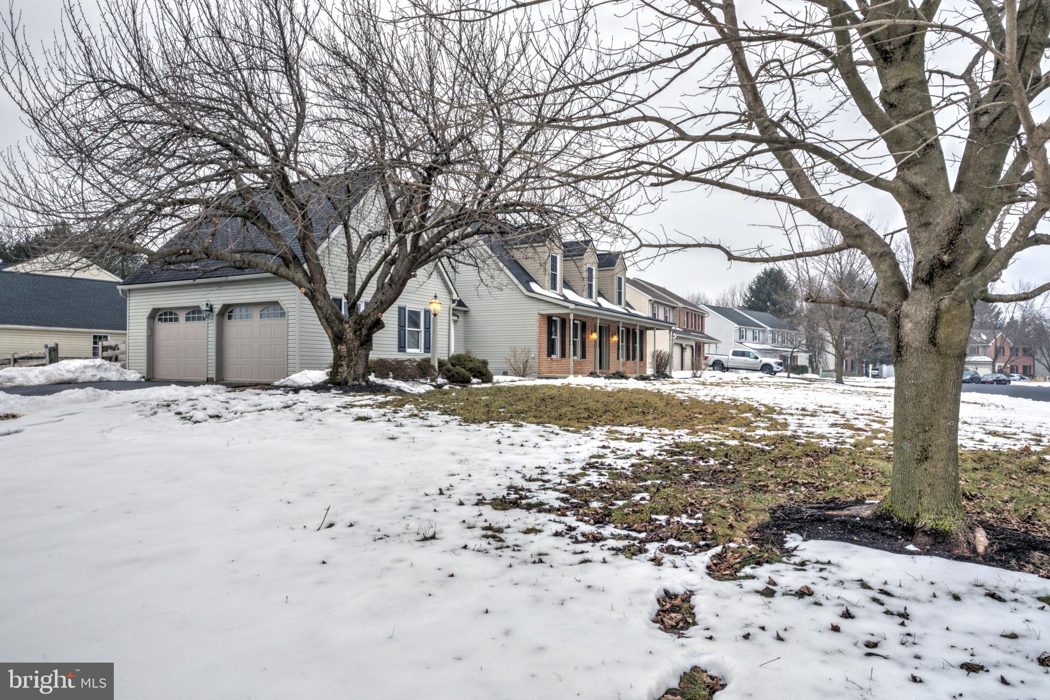 152 Kings Gate Drive Lititz, PA 17543 - Photo 39 of 45 a front view of a house with a yard covered in snow