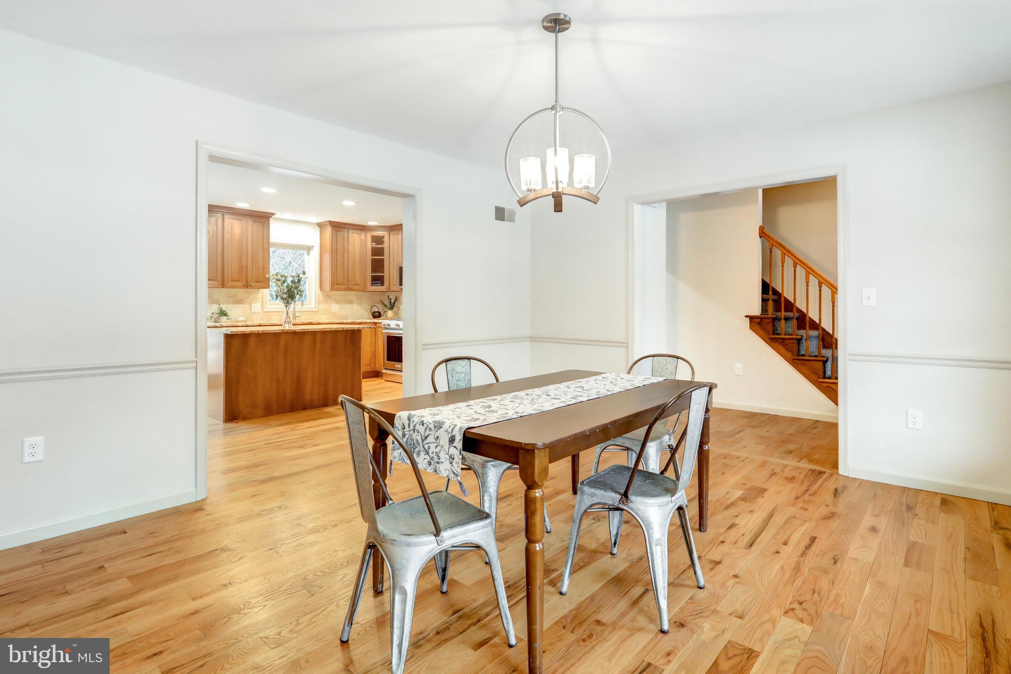 152 Kings Gate Drive Lititz, PA 17543 - Photo 7 of 45 a view of a dining room with furniture wooden floor and chandelier