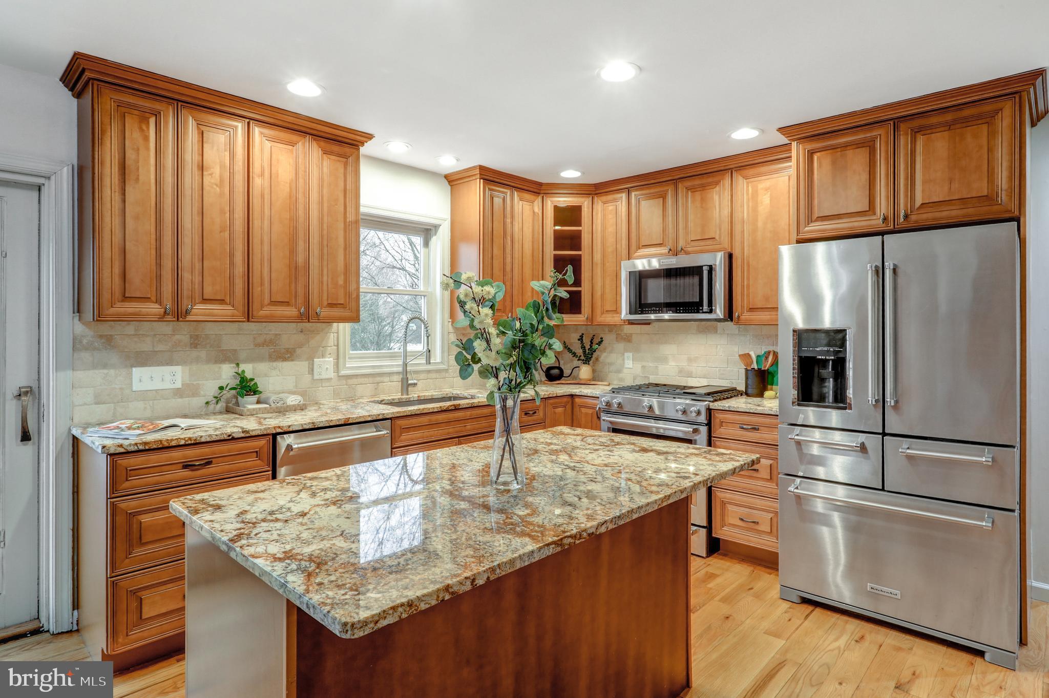 152 Kings Gate Drive Lititz, PA 17543 - Photo 9 of 45 a kitchen with stainless steel appliances granite countertop a refrigerator a stove and a sink