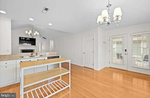 a kitchen that has a lot of cabinets in it