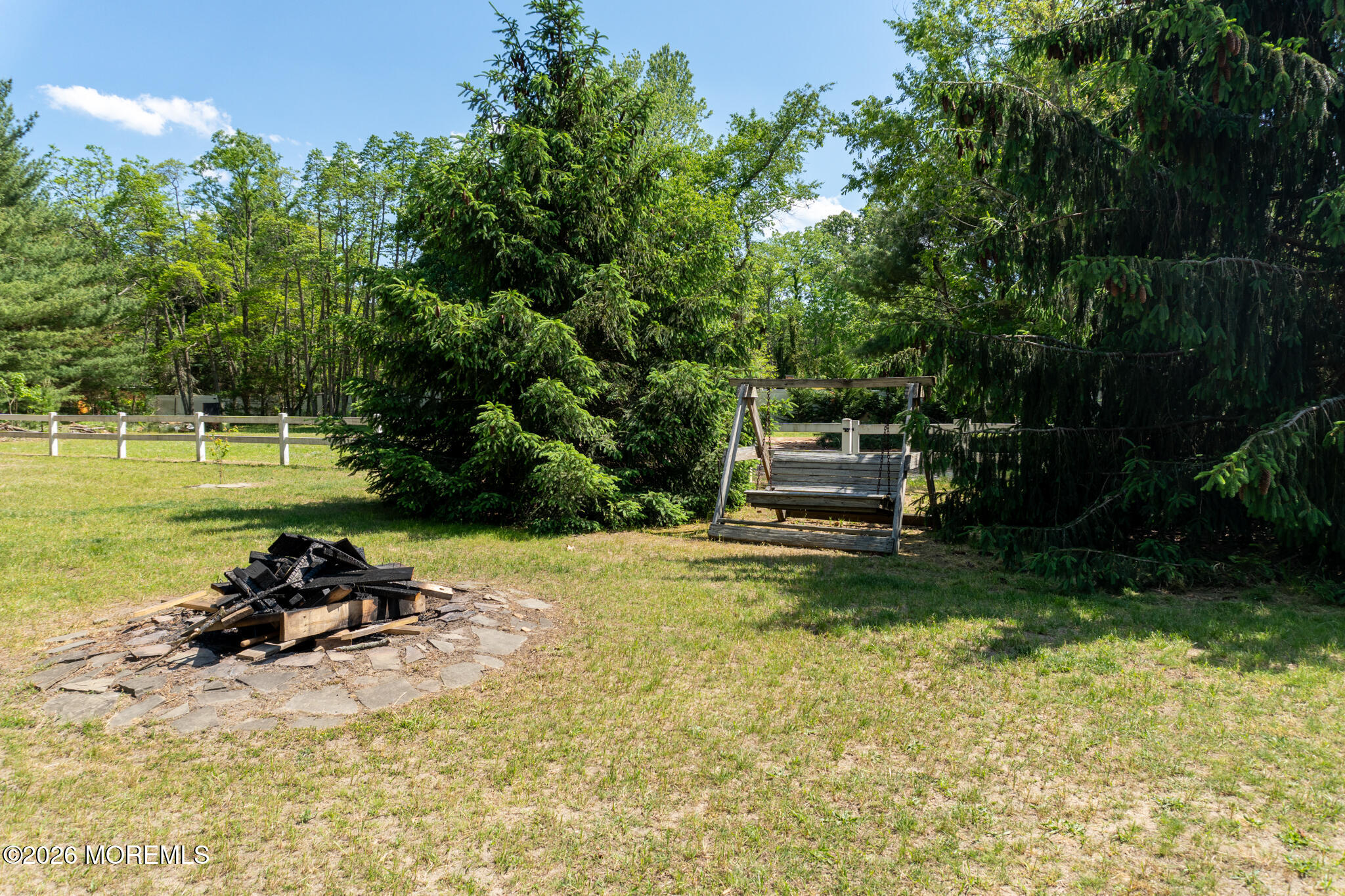 55 Toms River Road Jackson, NJ 08527 - Photo 31 of 31 a backyard of a house with table and chairs