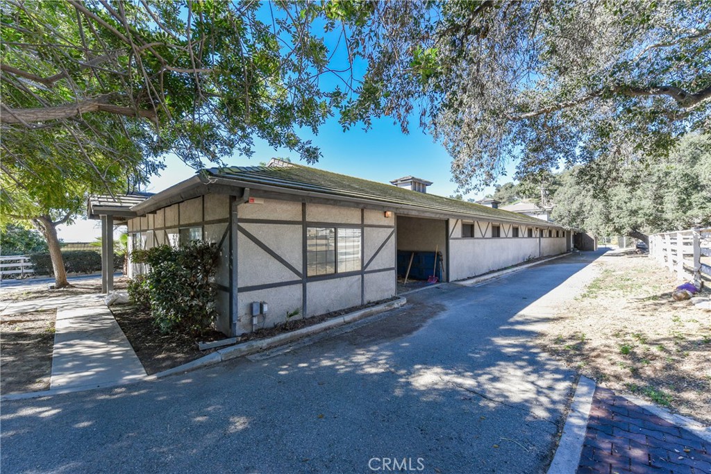 99 Bliss Canyon Road Bradbury, CA 91008 - Photo 16 of 49 a view of a house with a yard and pathway