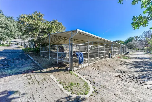a view of a lake with a bench and trees