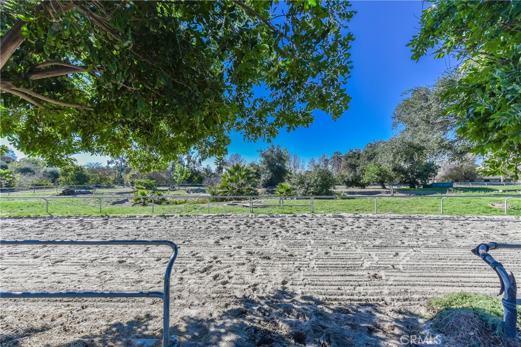 99 Bliss Canyon Road Bradbury, CA 91008 - Photo 34 of 49 a view of a lake with a bench and trees