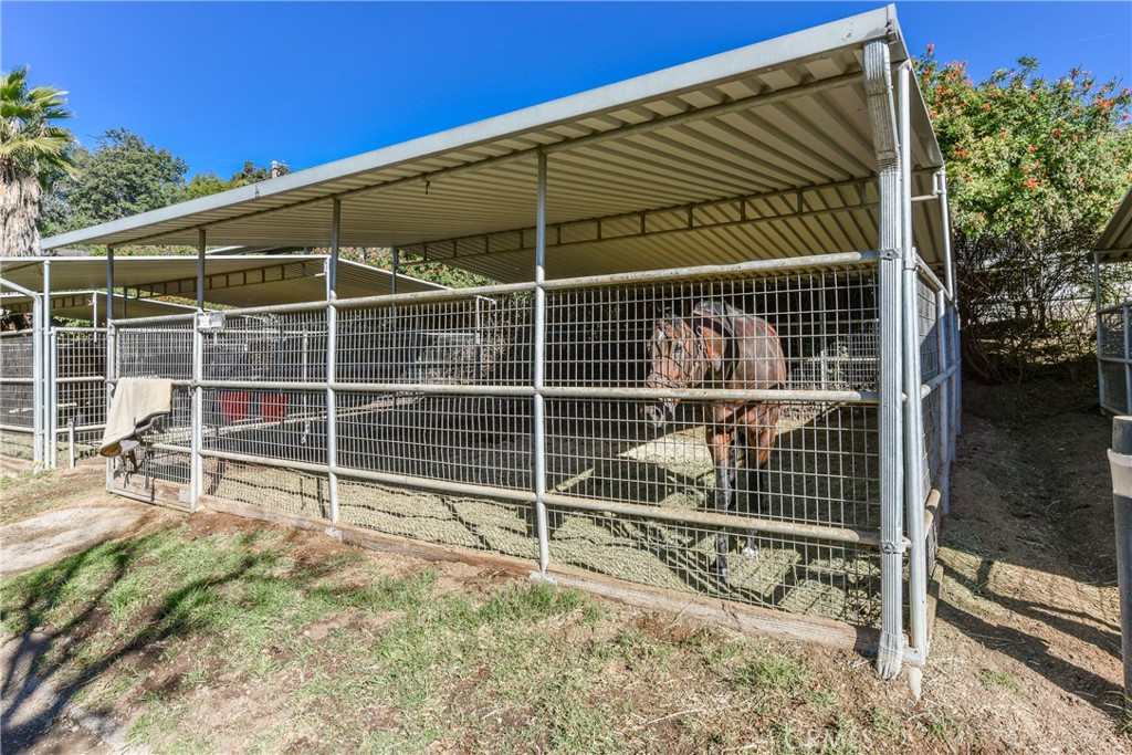 99 Bliss Canyon Road Bradbury, CA 91008 - Photo 35 of 49 a view of an empty room with wooden floor and fence