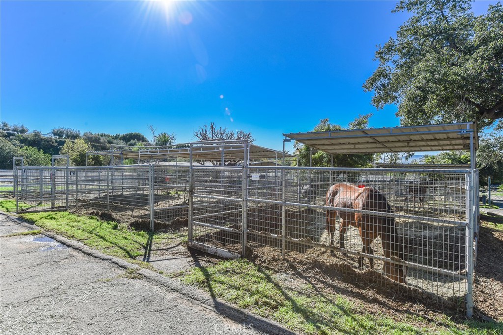 99 Bliss Canyon Road Bradbury, CA 91008 - Photo 36 of 49 a view of a pathway with a wooden fence
