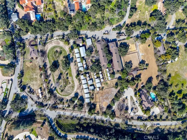 an aerial view of residential houses with outdoor space