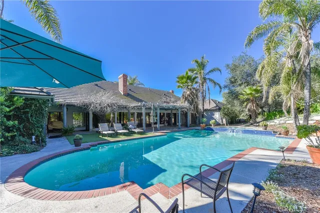 a view of a house with swimming pool