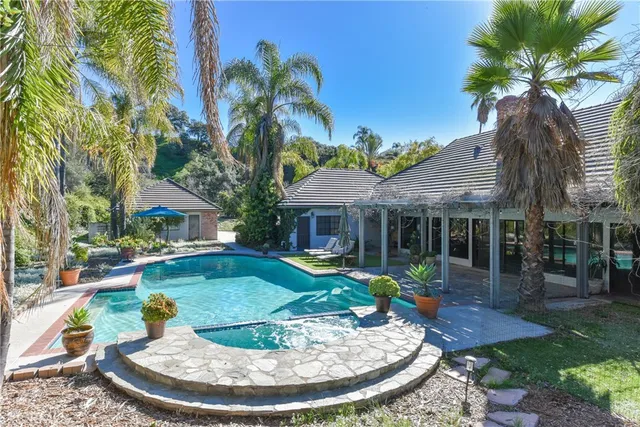 a view of a house with swimming pool