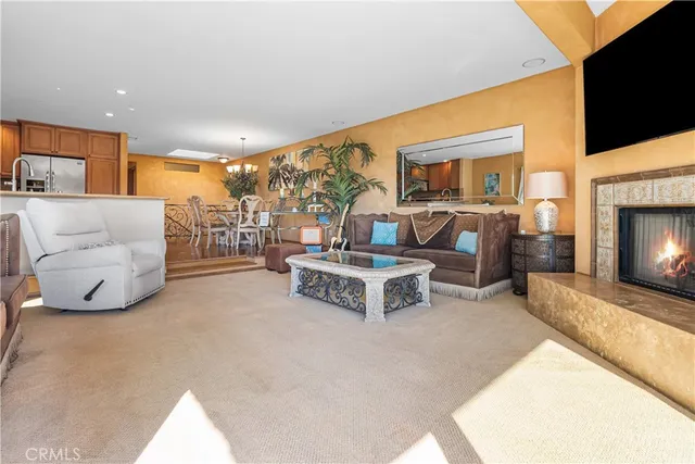 a balcony with wooden floor table and chairs