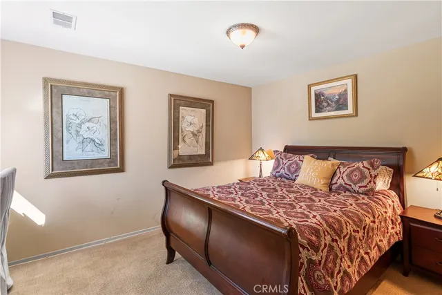 a view of walk in closet with window and bathroom