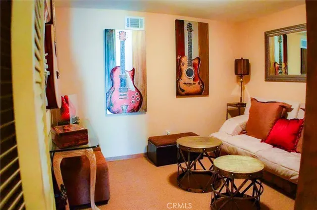 a view of a livingroom with furniture and a fireplace