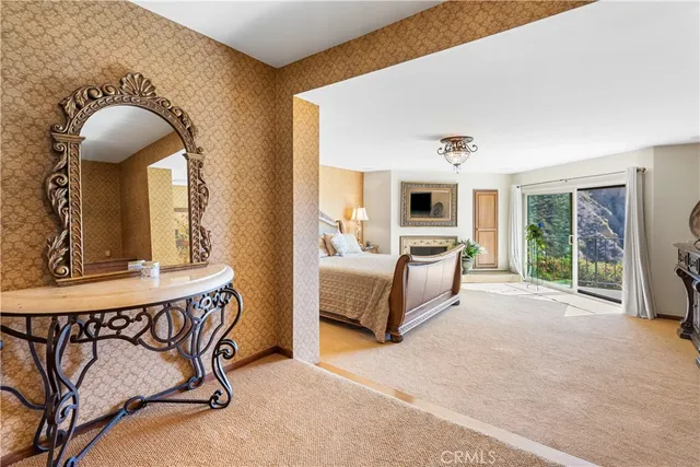 a bedroom with a bed and a fireplace