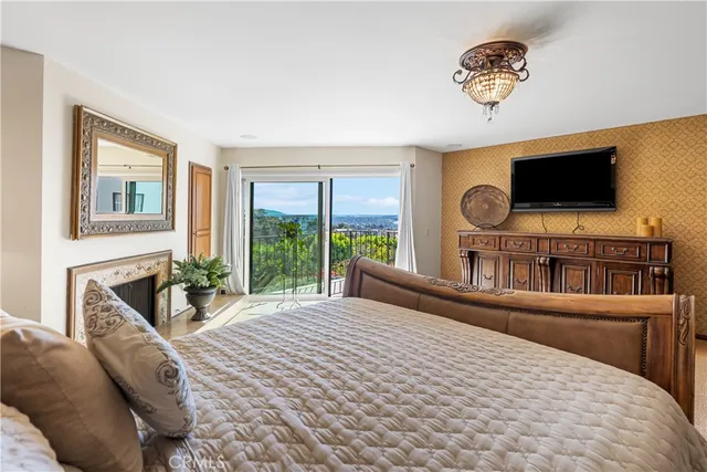 a view of walk in closet with clothes