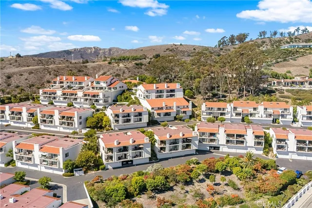 an aerial view of houses with outdoor space