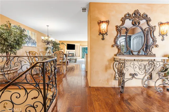 a view of a entryway with furniture and wooden floor