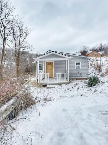 a house view with a backyard space