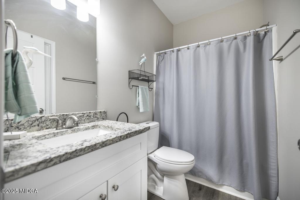 219 Diamond Place Gray, GA 31032 - Photo 25 of 42 a bathroom with a granite countertop sink and a mirror
