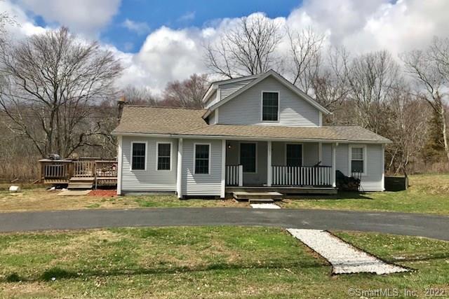 1051 Norwich Road Plainfield, CT 06374 - Photo 1 of 1 a front view of a house with a yard