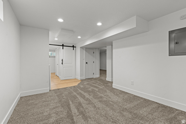 2101 West 3900th Street South Roy, UT 84067 - Photo 23 of 36 Spacious room with gray carpet flooring and recessed lighting