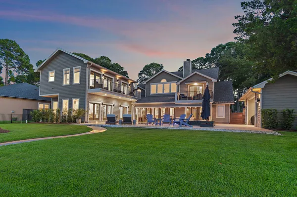 a front view of building with yard and green space