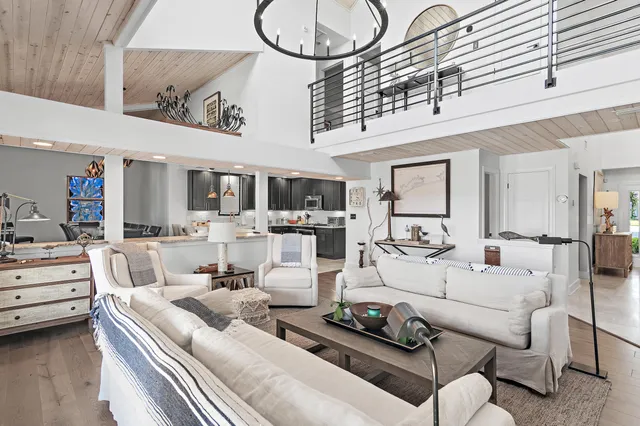 a large kitchen with a table and chairs