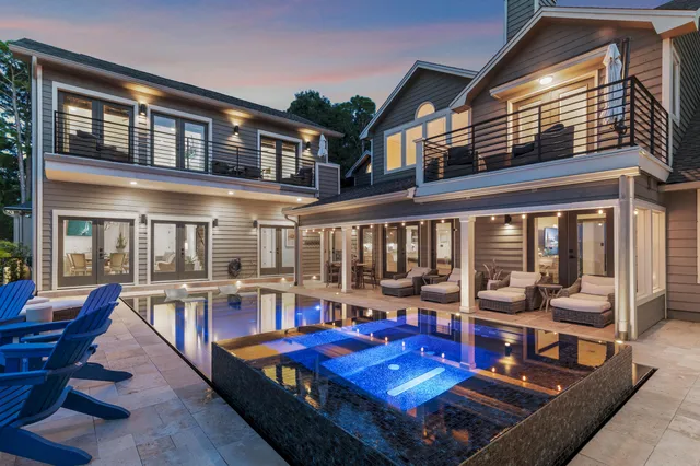 a view of a patio with couches table chairs and potted plants
