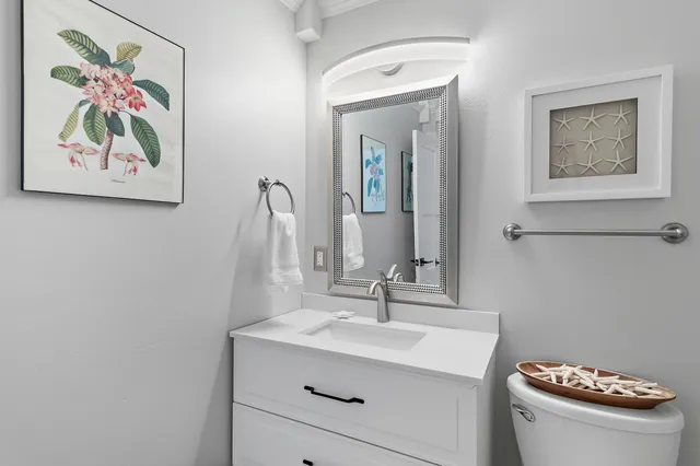 a bathroom with a double vanity sink mirror double and bathtub