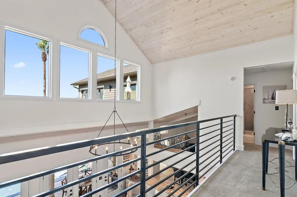 a bedroom with a bed and a mirror on the dresser