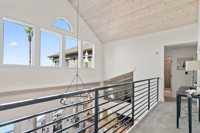 a bedroom with a bed and a mirror on the dresser