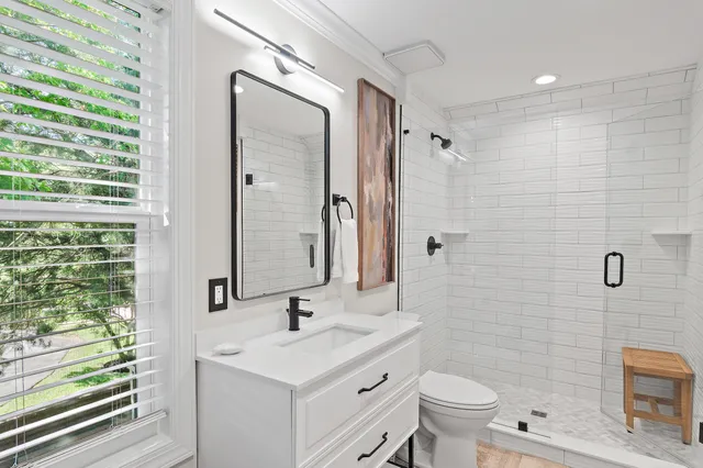 a bedroom with a bed and a desk