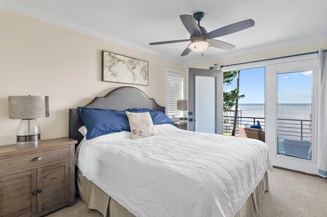 a living room with furniture or chandelier and a wooden floor