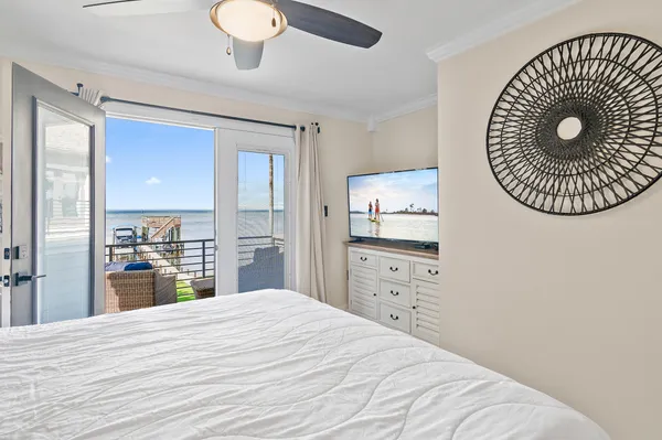 a large white bed in a white room