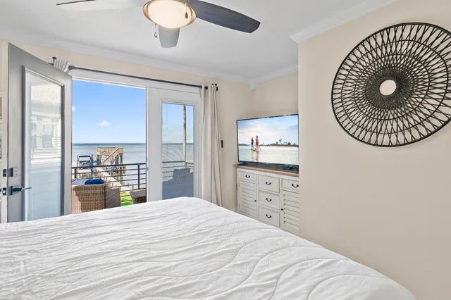 a large white bed in a white room