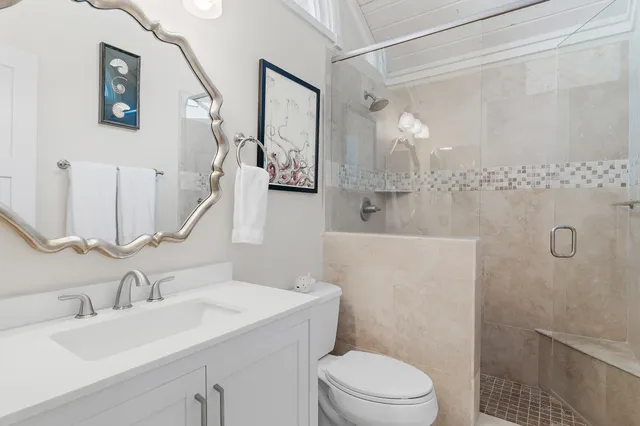 a view of a patio with dining table and chairs