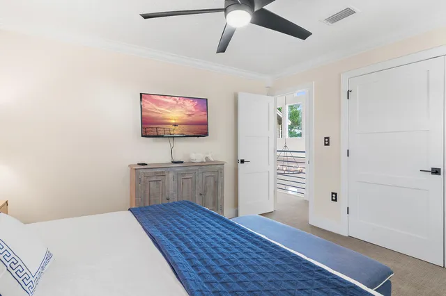 a bathroom with a toilet sink vanity and shower
