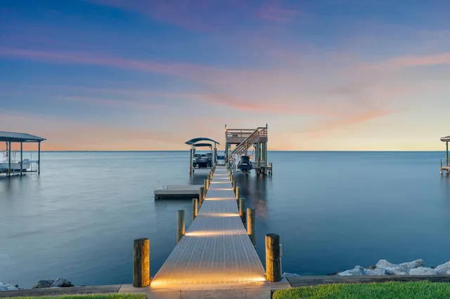 a front view of a house with a yard table and chairs
