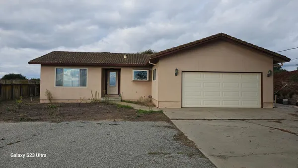 a view of house with garage